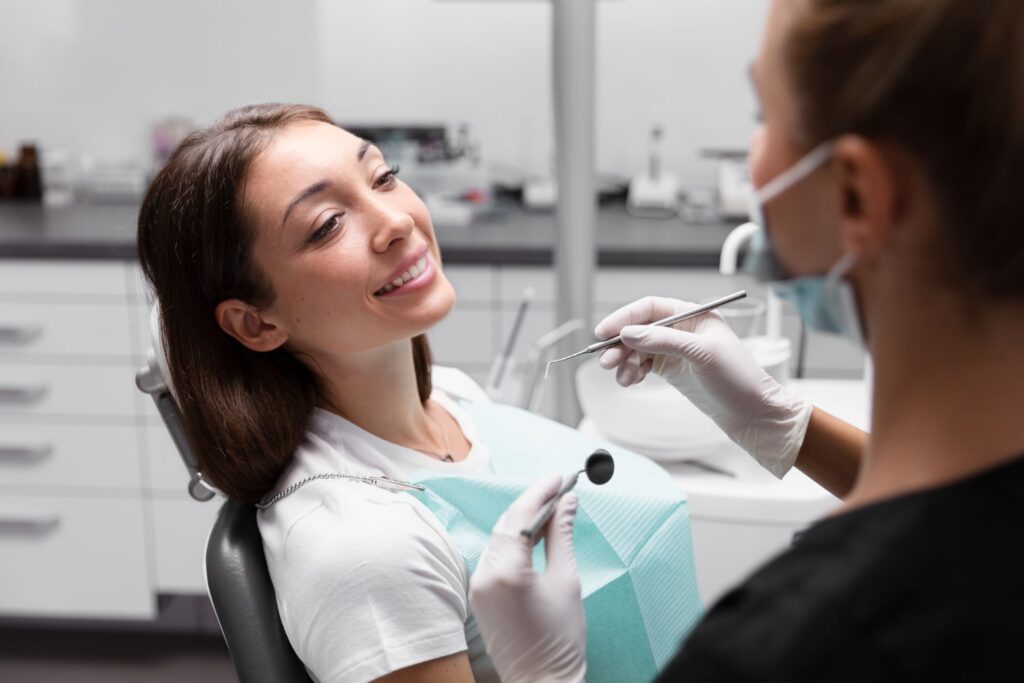 close up smiley patient dentist clinic asking if do they put you to sleep for wisdom teeth