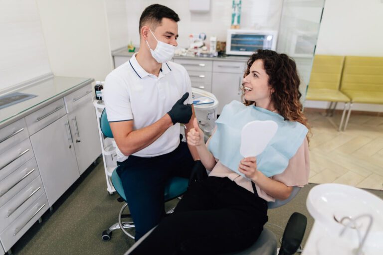 Dentist and patient happy and smiling arguing does insurance cover invisalign