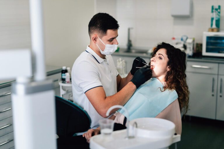 Dentist examining the patient in the office